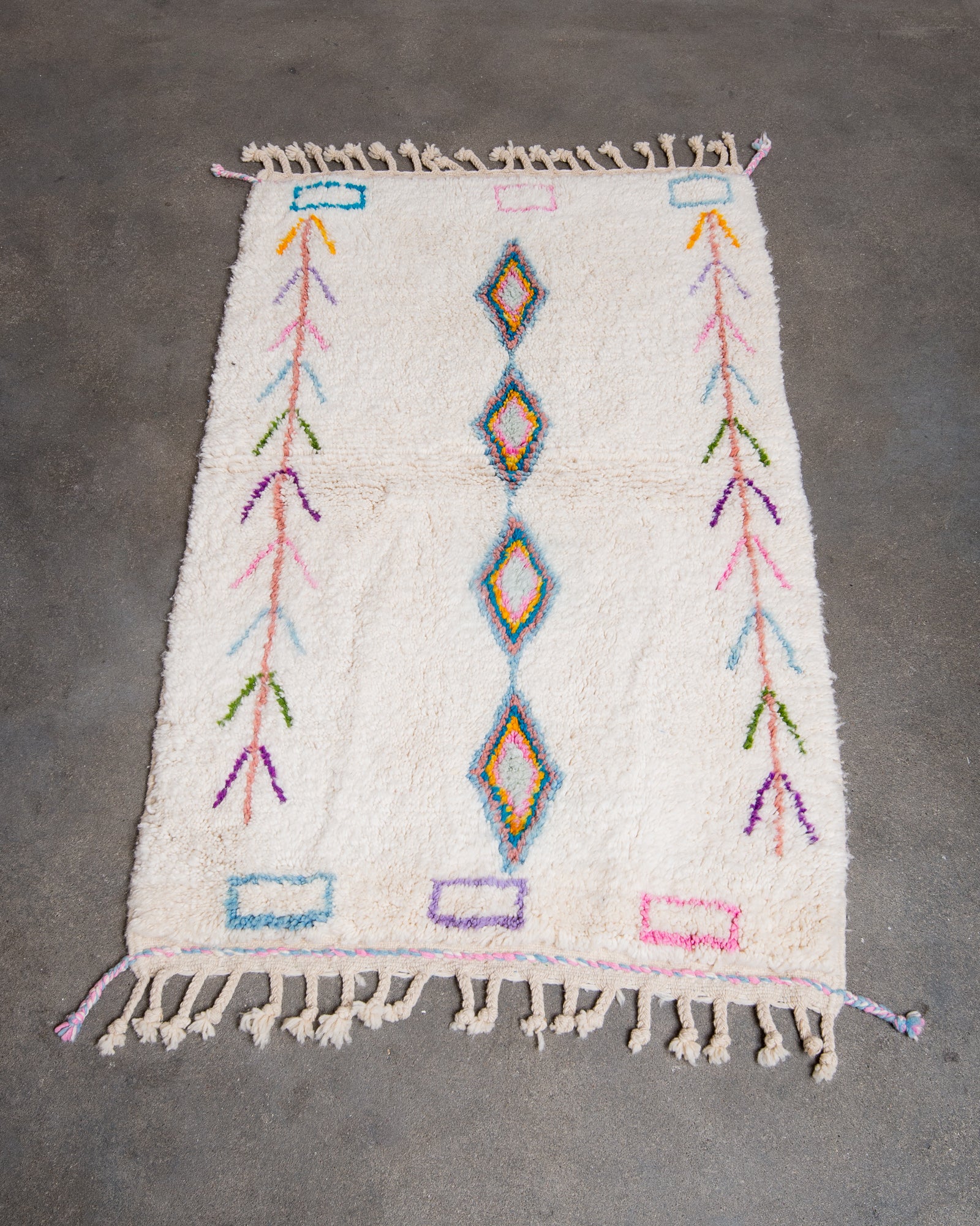 Modern, designer, handcrafted Berber rug from Morocco. Beniourain carpet with beautiful colours and patterns and fluffy wool texture.